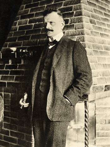 Jean Sibelius, standing at the fireplace at Ainola (1907)